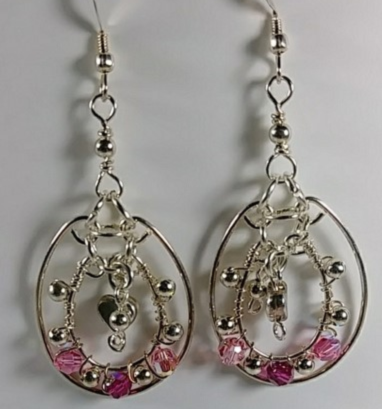606 - EAR - Description: Earrings: Sterling Silver Earrings, Swarovski Crystal, Sterling Silver Round and Heart Beads.(Sterling Silver Earwire) Dimension: 2 1/2 ' L (Inches)