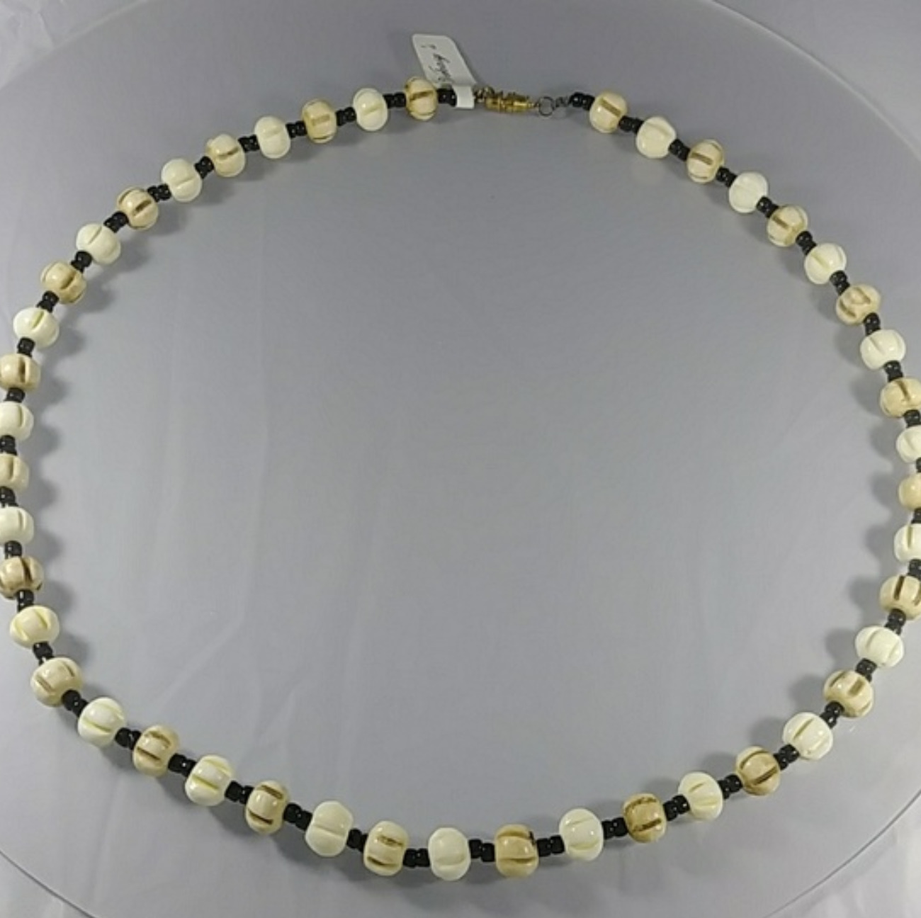 (377-NCK-MEN) - Description: Bone and Glass BeadS, Gold Tone. Barrel Closure - Dimension: 25 ' L (Inches)