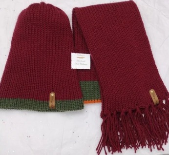 Item # 905 - Unisex Accessories - Material: 100% Acrylic / Custom Riveted Faux Leather Tags - Care: Hand Wash, Cold Water, Dry Flat - Construction: Double Layered Knit Scarf and Beanie - Size: Adult (One Size) Stretchable Beanie and Matching Scarf (See photos for measurement indicators) - Color(s): Burgundy, Orange, Mixed Color Variation and Forrest Green - Item packed in clear resealable plastic storage bag