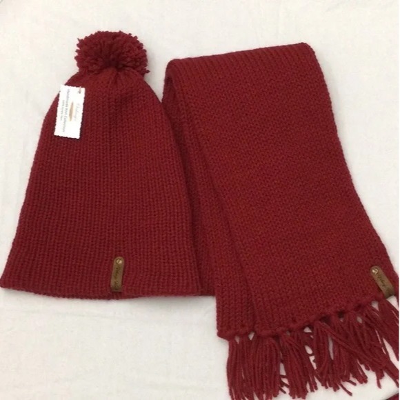 Item # 920 - Unisex Accessories - Material: 100% Acrylic Yarn, Custom Riveted Faux Leather Tags Construction: Double Layered Knit Scarf and Beanie Color(s): Claret Red Size: OS Stretchable
