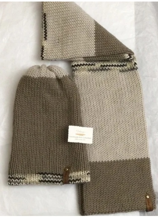 Item # 916 - Unisex Accessories - Material: 100% Acrylic Yarn, Custom Riveted Faux Leather Tags Construction: Double Layered Knit Scarf and Beanie Color(s): Soft Taupe, Barley and Mixed-Colored Yarn Size: OS Stretchable)