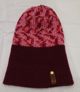 Item # 2001 - Unisex Accessory - Material: 100% Acrylic Yarn / Custom Faux Leather Tag - Care: Hand Wash, Cold Water, Dry Flat - Construction: Reversible, Double Layered Knit Beanie (handmade) - Size: Adult (One Size) Stretchable - Color(s): Burgundy and Multi-Colored Yarn - Item packed in clear resealable plastic storage bag
